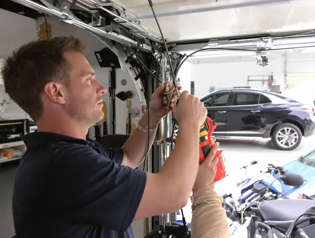 Delray Beach Garage Door Repair safety certified technician performing cable replacement in Delray Beach