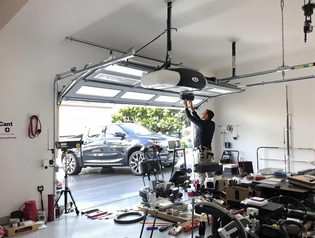 Delray Beach Garage Door Repair specialist installing smart garage door opener system in Delray Beach home